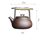 Ceramic teapot with measurements on a white background