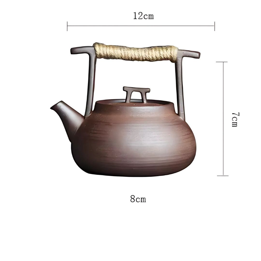 Ceramic teapot with measurements on a white background