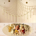 Netting structure with plush toys underneath, decorated with stars on a beige background