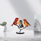 Colorful stained glass bird lamp on a branch with a white background
