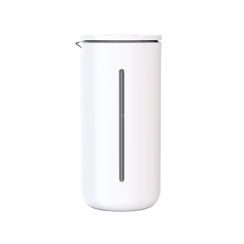 White milk frothing pitcher with a silver spout on a white background