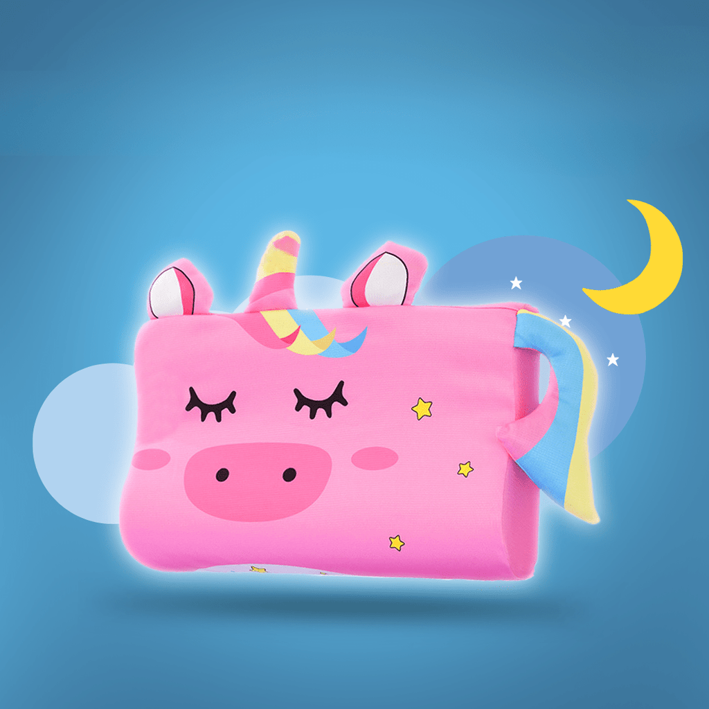 Pink unicorn-shaped pillow with a blue background