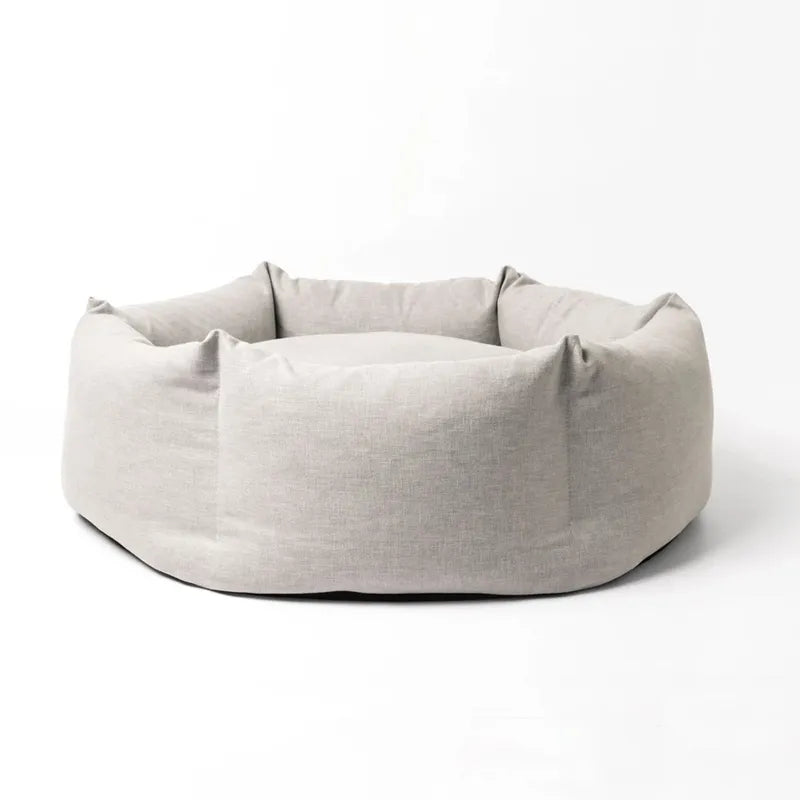 Light gray pet bed on a white background