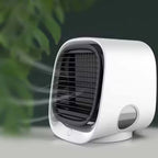 Portable air cooler on a blurred green background