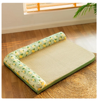 Pet bed with green floral pattern on a wooden floor