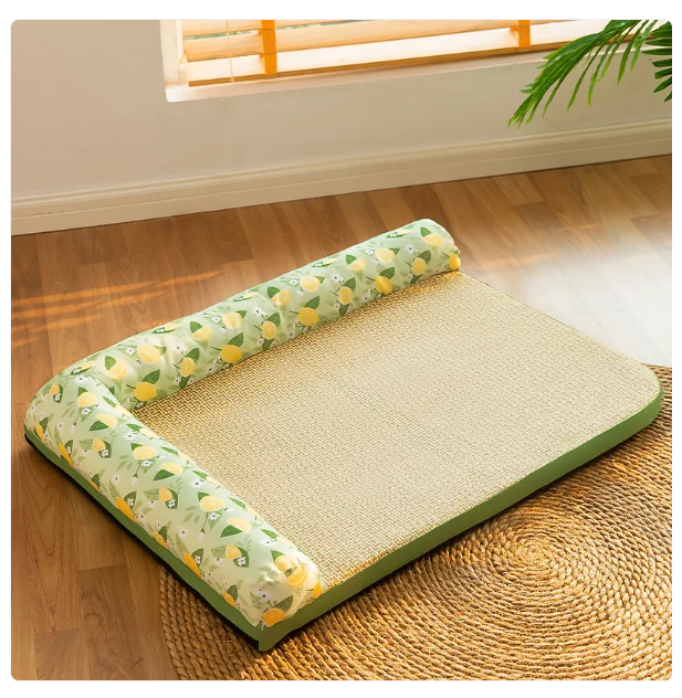 Pet bed with green floral pattern on a wooden floor