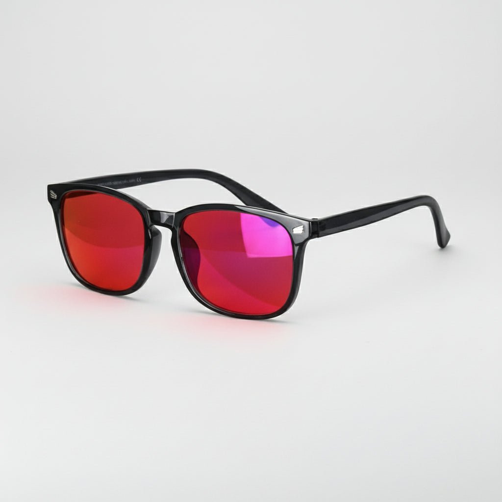 Sunglasses with red-tinted lenses on a light gray background